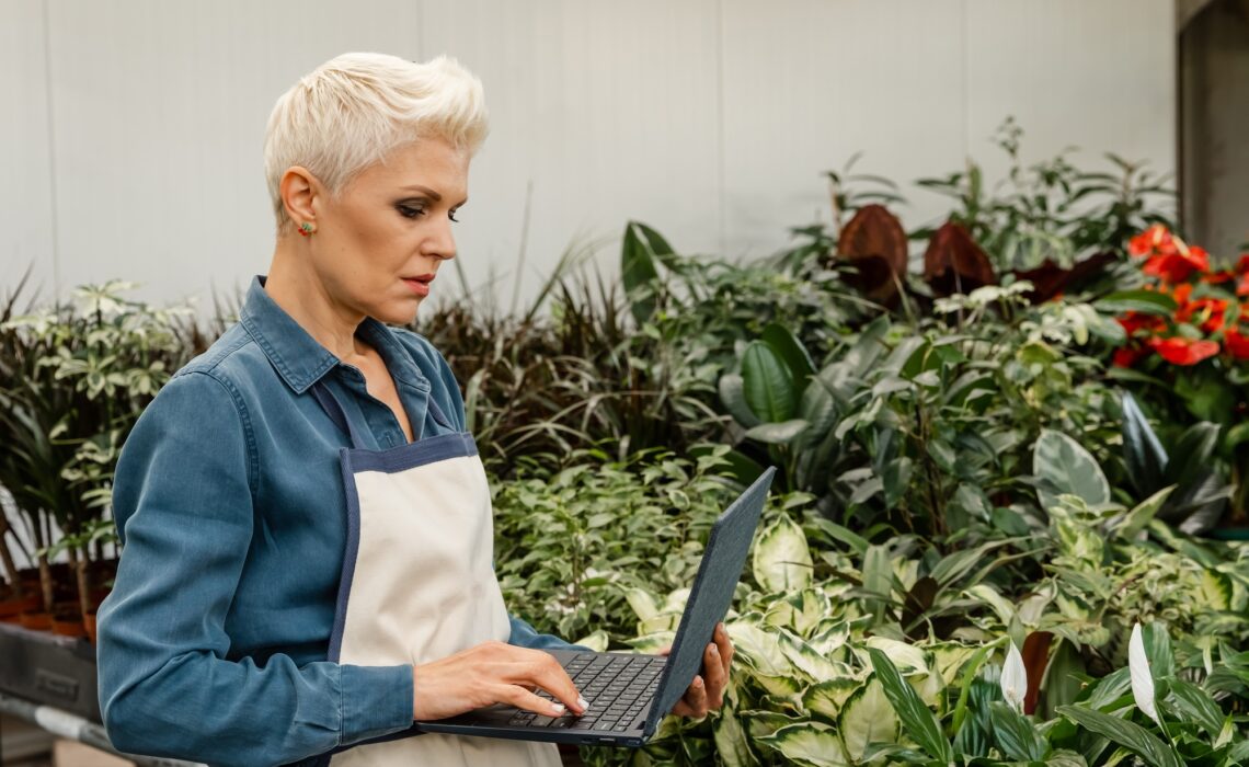 Woman watching gardening tutorials. Plant care. Gardening